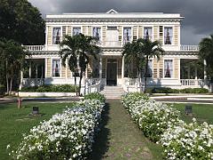 01A Devon House mansion was built in 1881 and is a beautiful blend of Caribbean and Georgian architecture painted white with wooden shutters with a beautiful garden in Kingston Jamaica